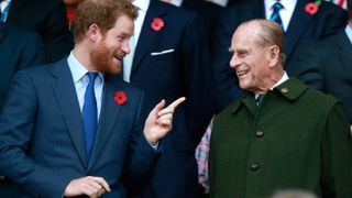 Prince Harry and Prince Phillip enjoy the atmosphere during the 2015 Rugby World Cup Final