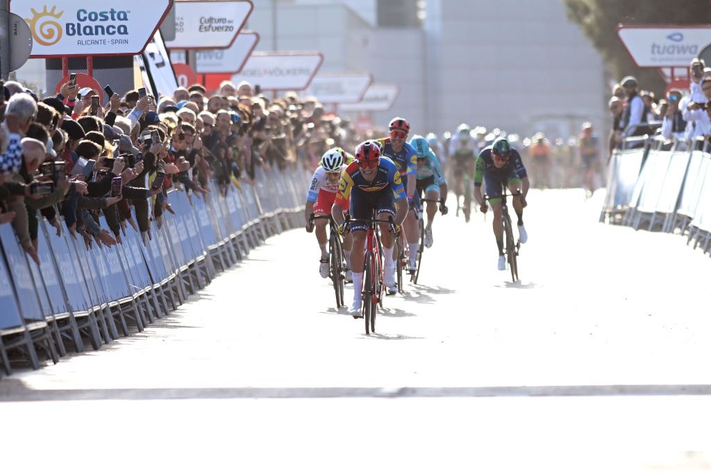 ORIHUELA SPAIN FEBRUARY 02 Jonathan Milan of Italy and Team Lidl Trek sprints at finish line to win the 75th Volta a la Comunitat Valenciana 2024 Stage 3 a 1613km stage from San Vicente del Raspeig to Orihuela on February 02 2024 in Orihuela Spain Photo by Dario BelingheriGetty Images