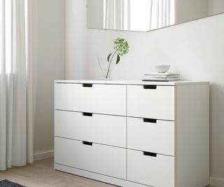 IKEA dresser against a white wall.
