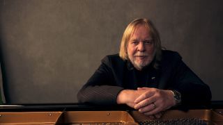 Rick Wakeman sat at a piano