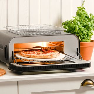 Electric pizza oven on kitchen counter