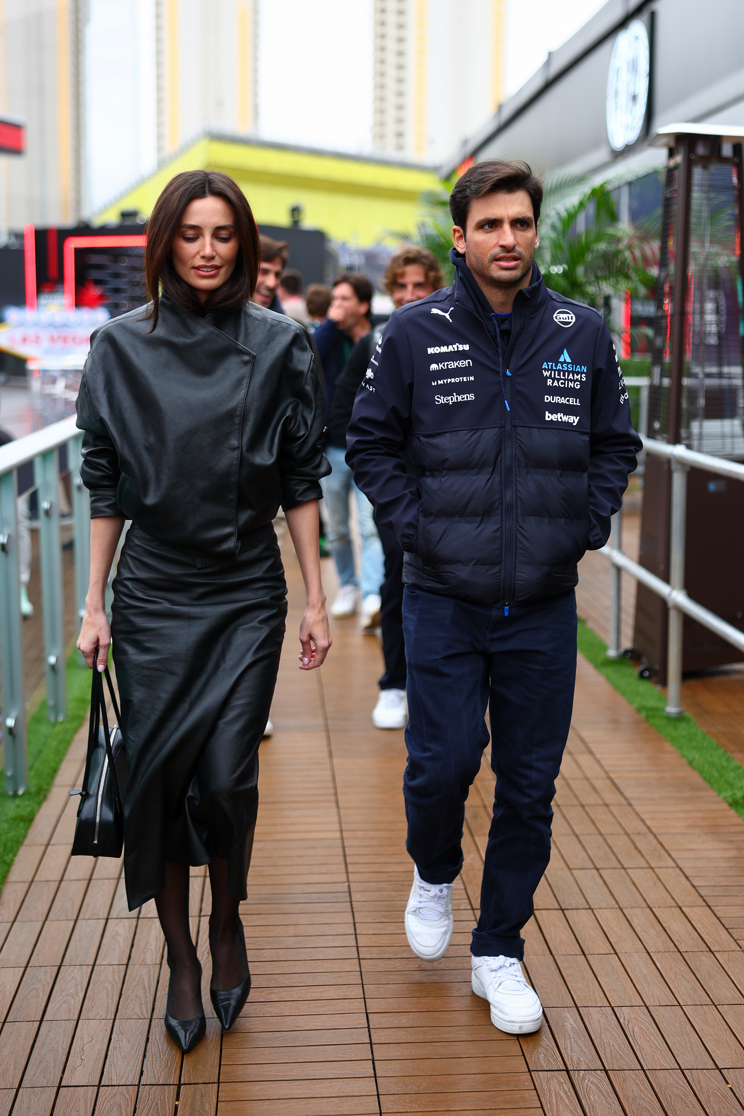 LAS VEGAS, NEVADA - NOVEMBER 21: Carlos Sainz of Spain and Williams and Rebecca Donaldson arrive in the Paddock prior to final practice ahead of the F1 Grand Prix of Las Vegas at Las Vegas Strip Circuit on November 21, 2025 in Las Vegas, Nevada.