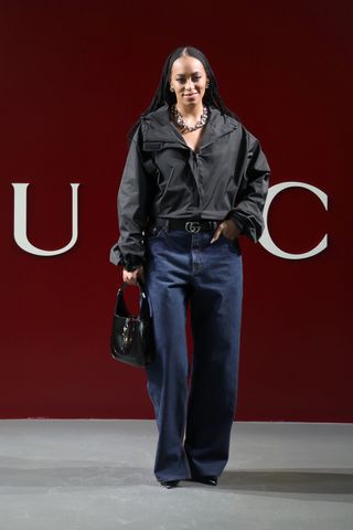 Solange Knowles Gucci show jeans blue denim black shirt pumps heels Milan Fashion Week
