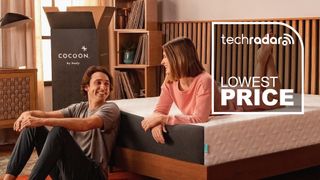 A couple sitting on the Cocoon by Sealy Chill Mattress in a bedroom, with a graphic overlaid saying "LOWEST PRICE"
