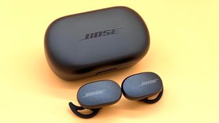 Bose QuietComfort Earbuds on yellow background