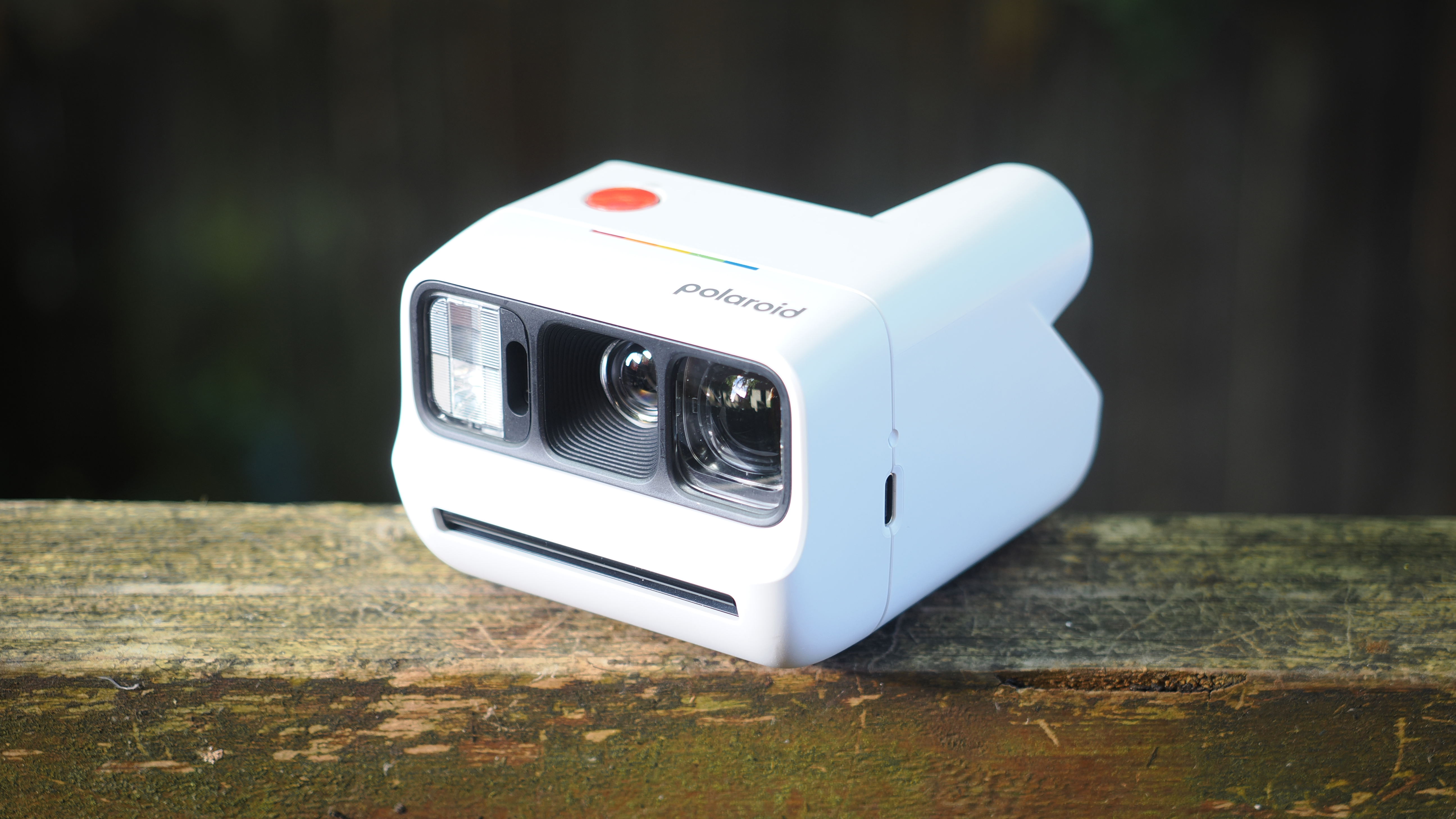 Polaroid Go Gen 3 on a wooden surface outdoors