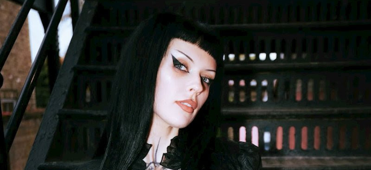 Harpy sitting on some steps