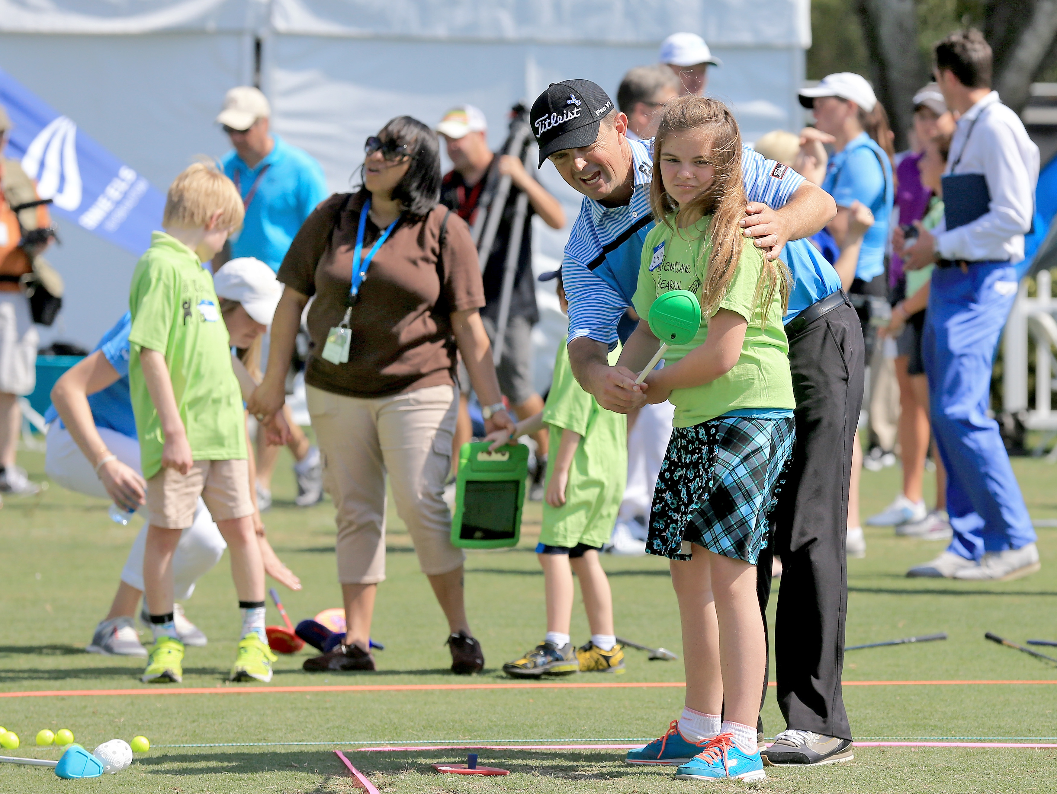 Kids having a golf lesson