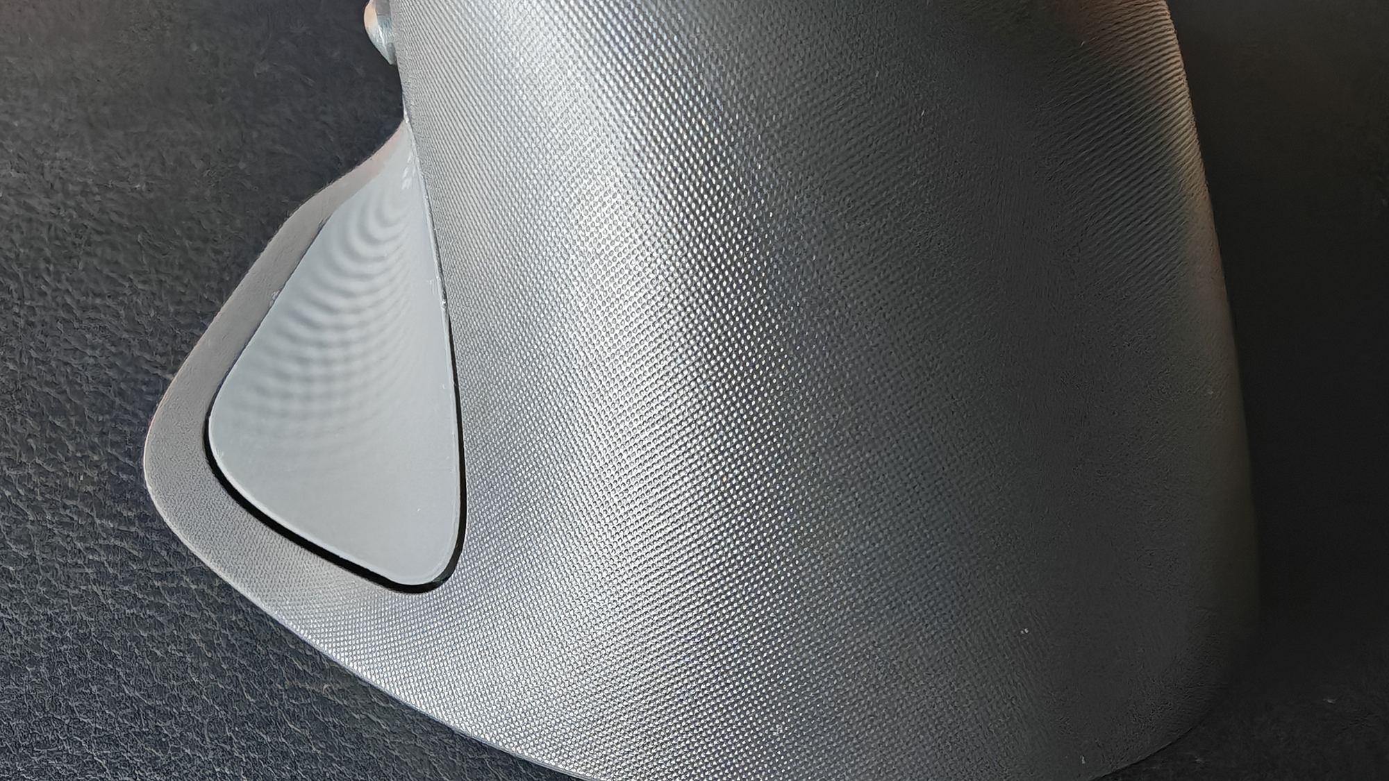 The Logitech MX Master 4 mouse, from different angles.