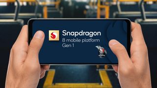 Snapdragon 8 Gen 1 logo displayed on a phone held in two hands