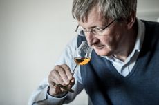 Dr Jim Beveridge smelling a glss of whisky