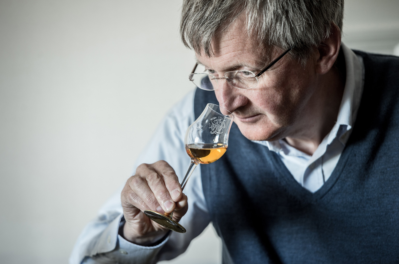 Dr Jim Beveridge smelling a glss of whisky