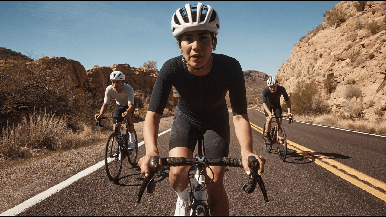 A group of three riders rides towards the camera