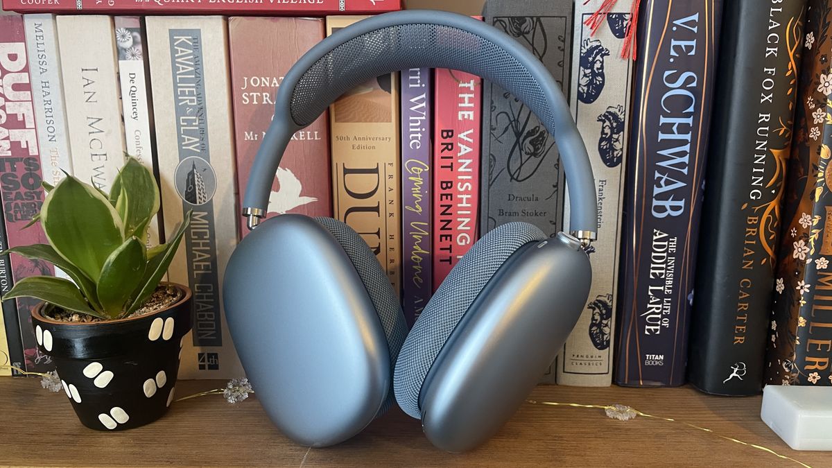 Apple AirPods Max 2024 in blue finish on bookshelf