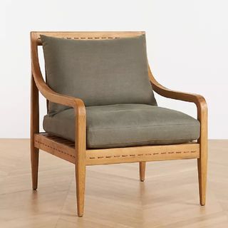 An accent chair with wooden arms