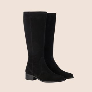 Flat lay image of black knee high suede boots