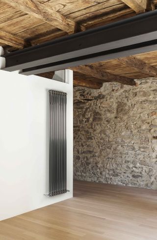 Contemporary radiator against brick wall
