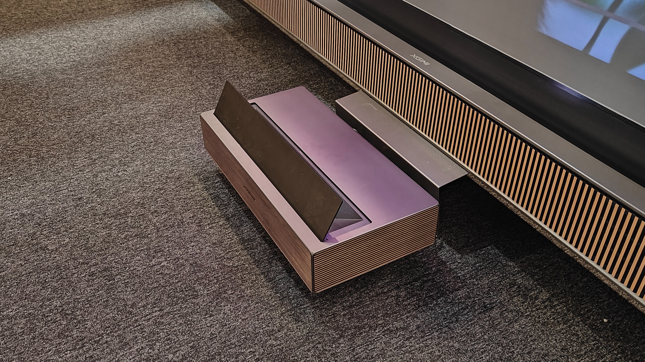 Xgimi Aura 3 Max projector on a carpet floor at IFA.