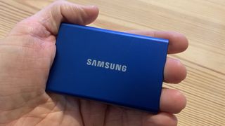 Samsung T7 SSD held in a hand