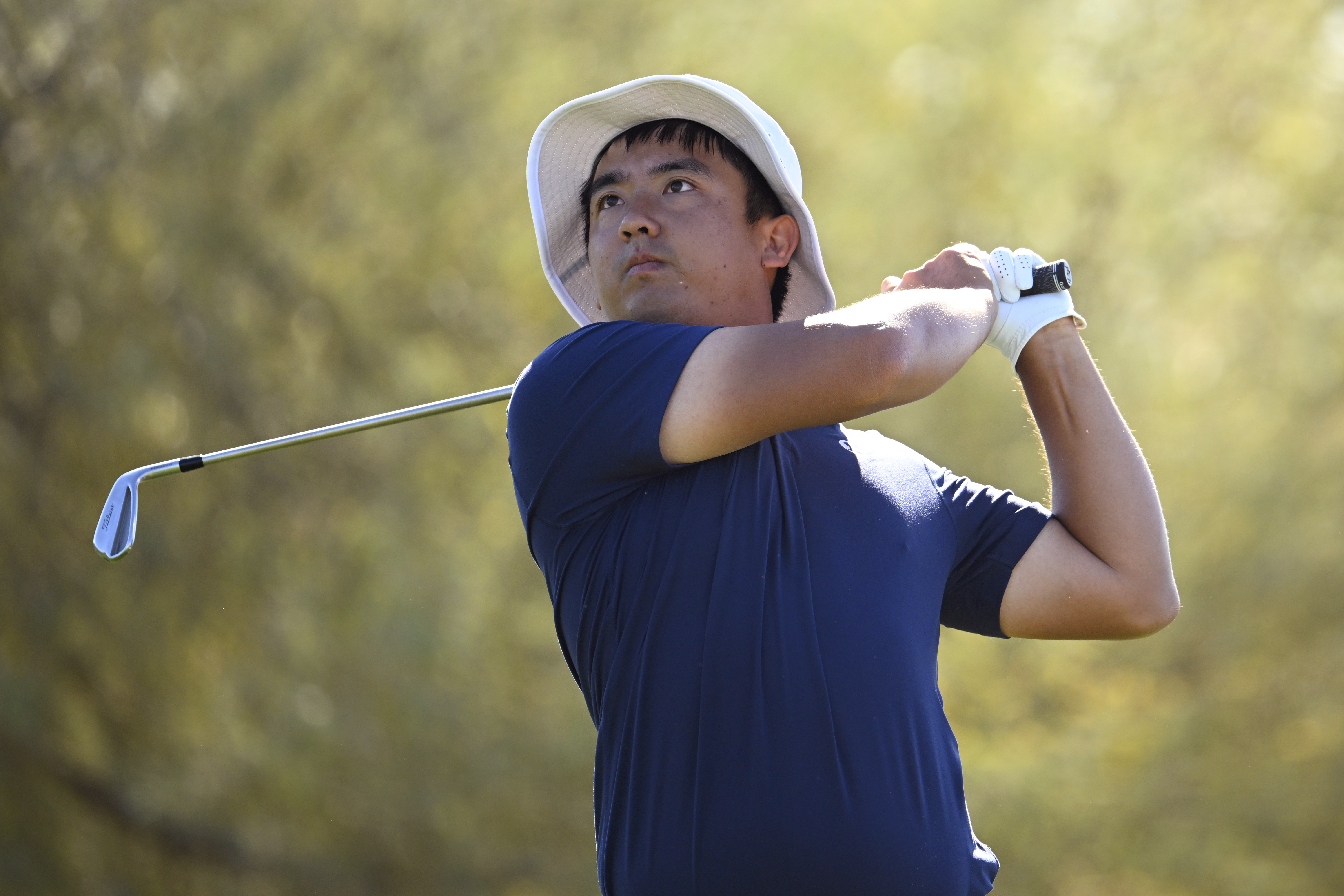 Zecheng Dou hits an iron