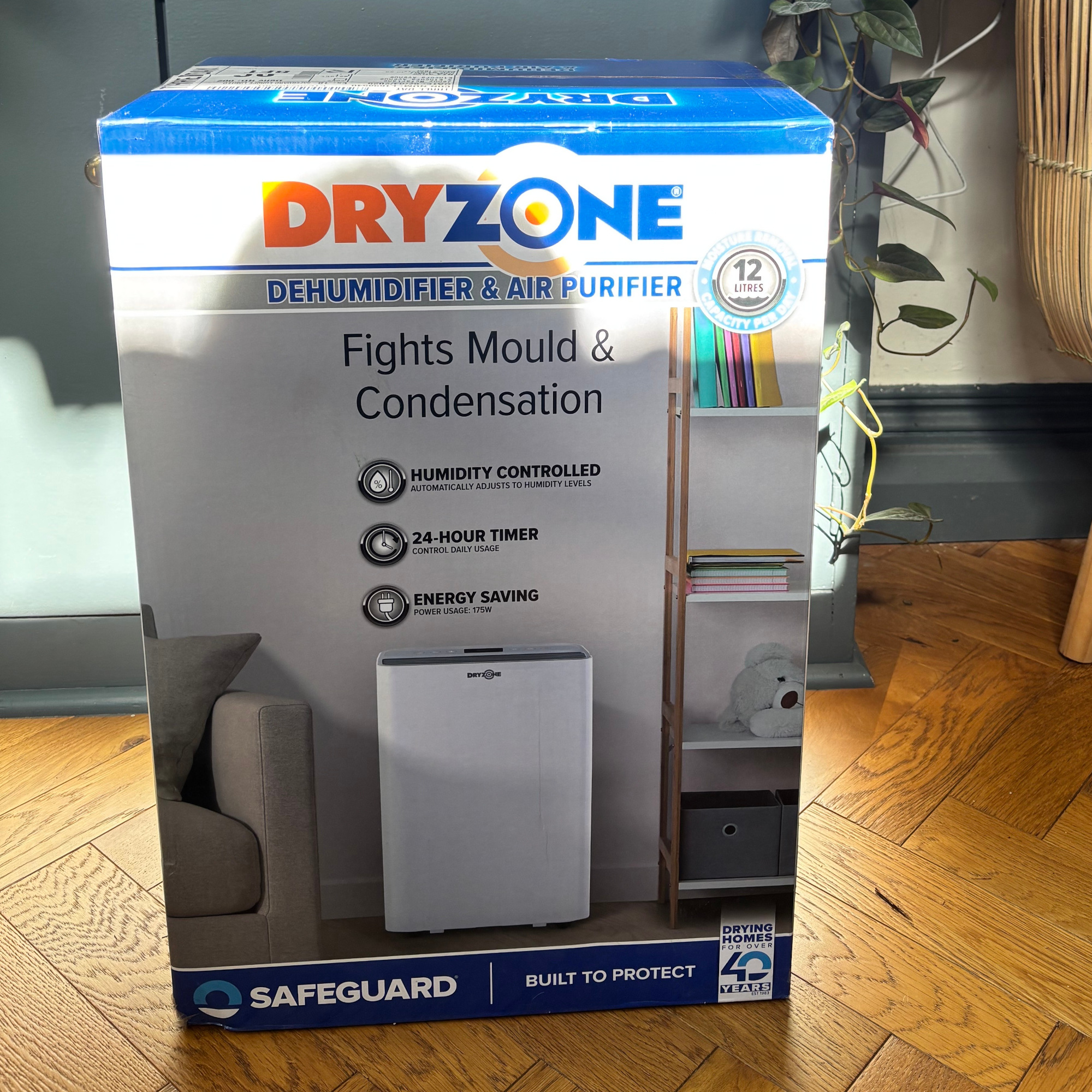 dryzone dehumidifier in its box in a hallway