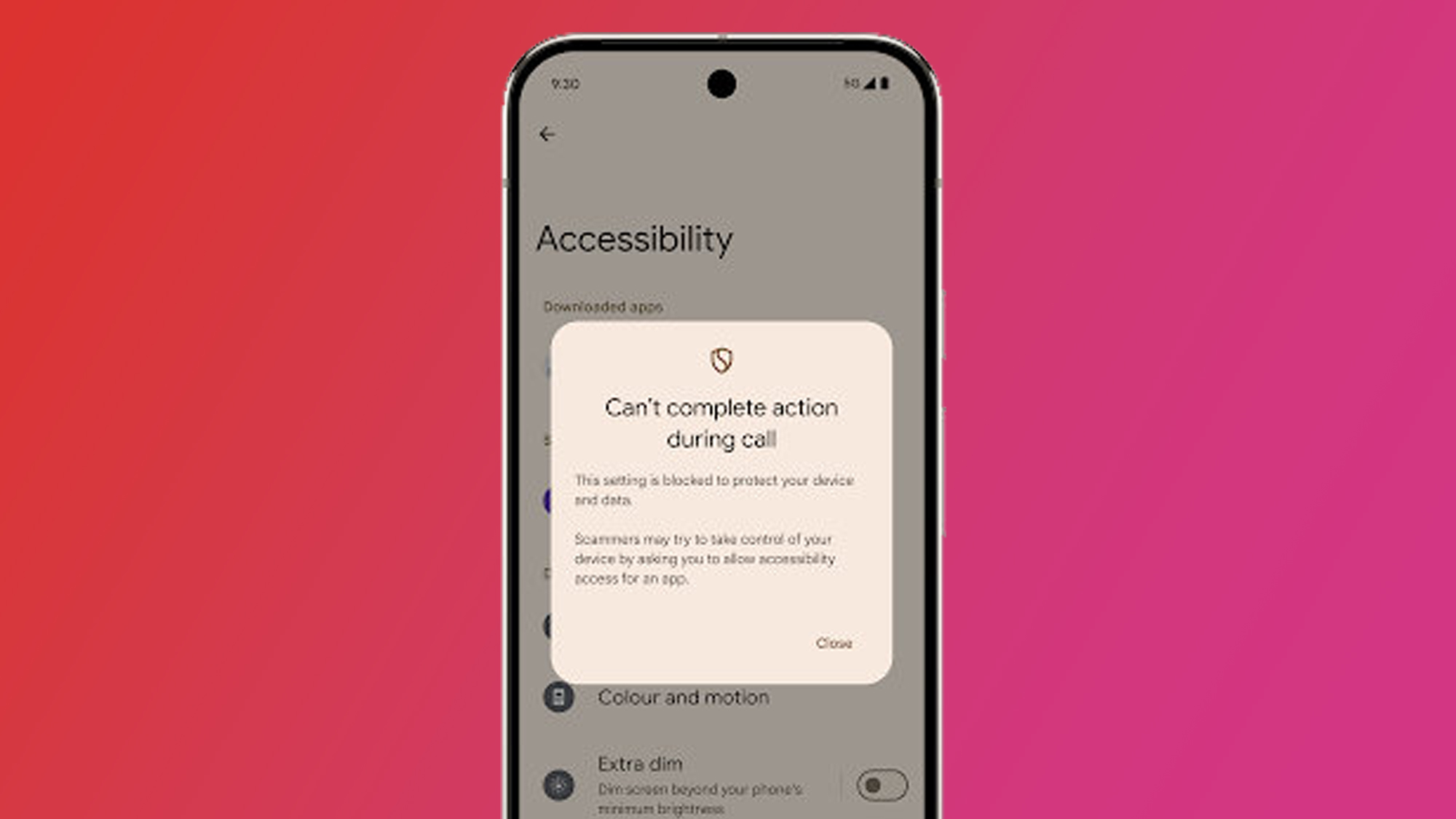An Android phone on a pink and red background showing Android 16