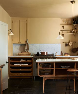 devol mid century modern kitchen with butter yellow walls