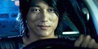 Fast and Furious Han Lue actor Sung Kang behind the wheel of a car