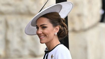 Kate Middleton wearing a white hat and dress at Trooping the Colour 2024