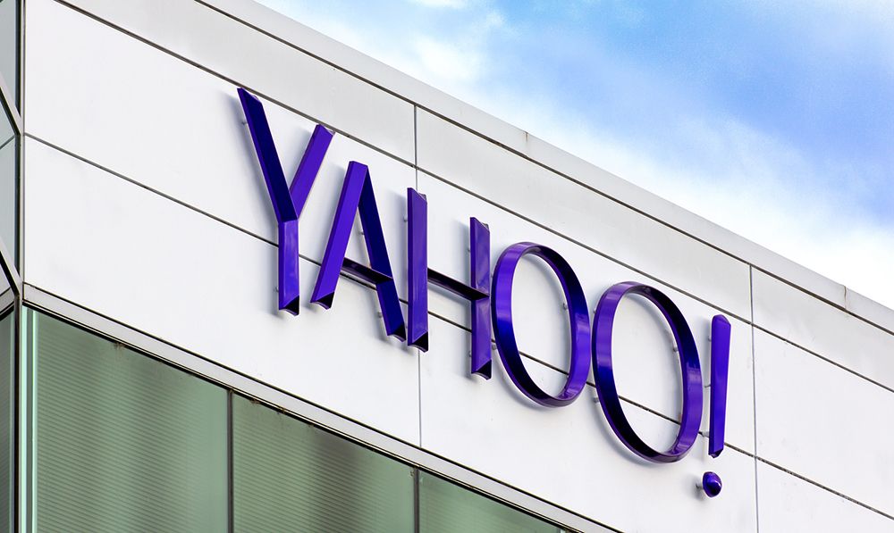 Yahoo! sign on top of a gray building