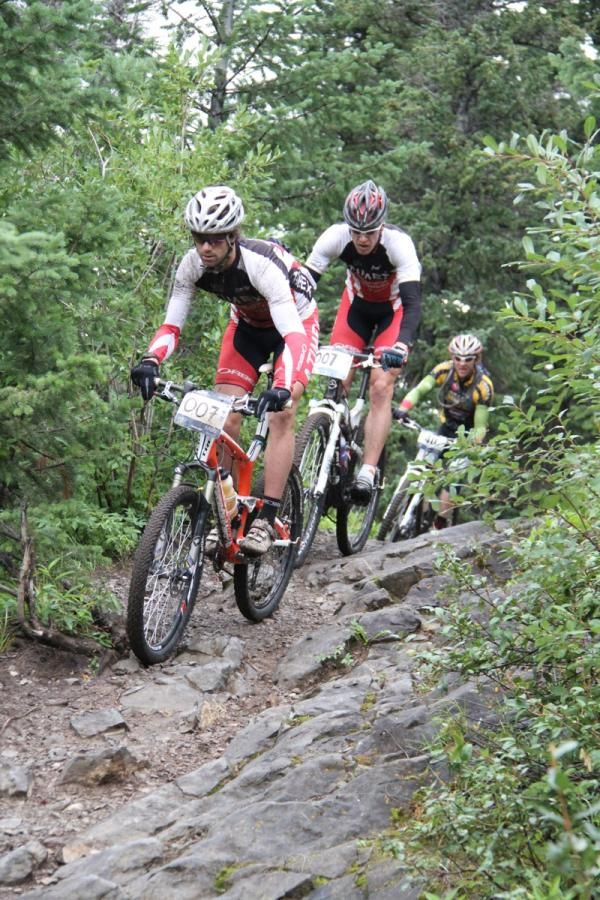 Matt Boober of Timex/Sugoi leads his teammate Will Kelsay and Dax Massey of Team Honey Stinger early in Stage 7