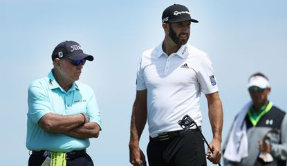 Harmon and Dustin Johnson watch on while DJ holds his putter