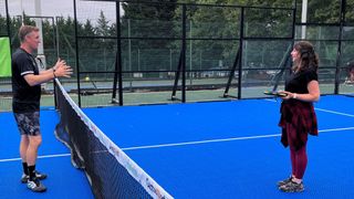 Susan Griffin facing coach, playing padel for beginners on court