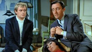 David McCallum and Robert Vaughn sitting next to each other in The Man From UNCLE.