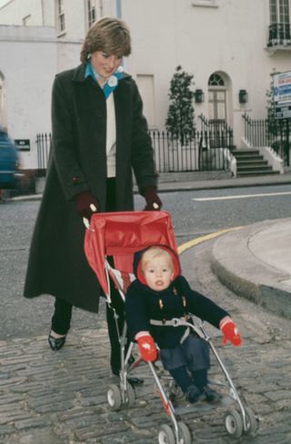 Lady Diana Spencer (1961-1997) takes her young charge Patrick Robertson for his daily outing in the Eaton Square, during her time as a nanny, London, UK, November 1980. (Photo by Jayne Fincher/Princess Diana Archive/Hulton Royals Collection/Getty Images)