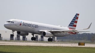 Urgent Evacuation of Airplane After Aboard Laptop Fires Up - An American Airlines Incident