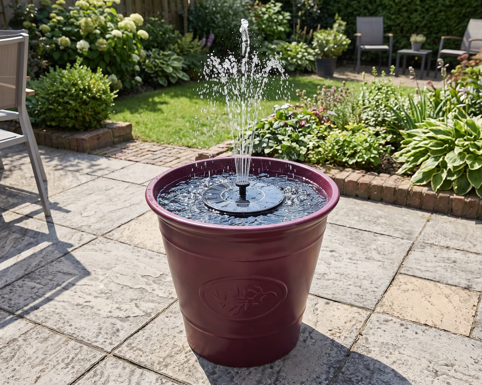 Belavi large resin planter from Aldi used to create a DIY garden water feature with a floating solar fountain