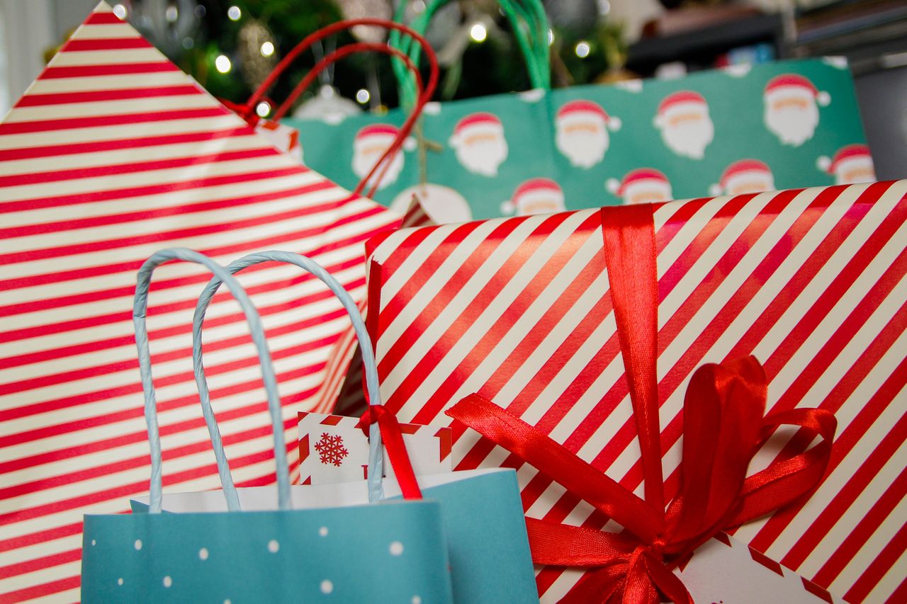 A pile of Christmas gift bags and presents