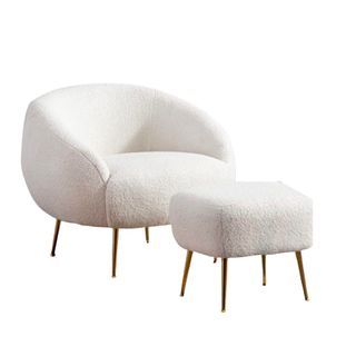 A cream boucle chair with ottoman