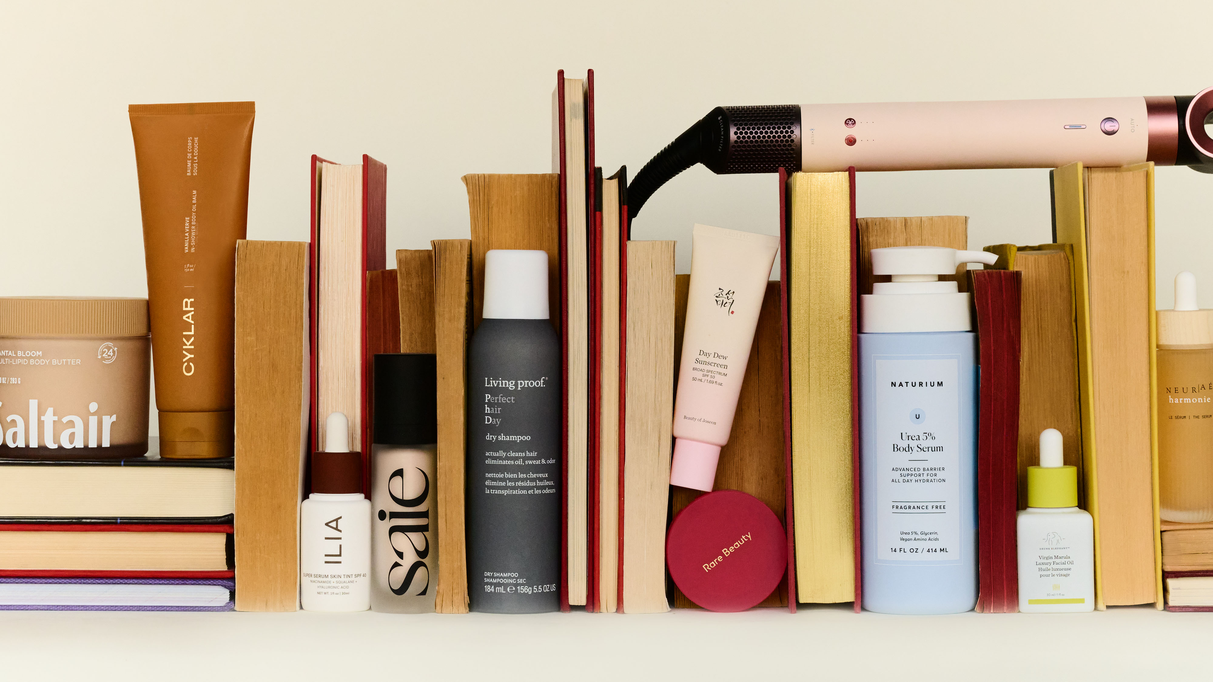 books against an arrangement of beauty products