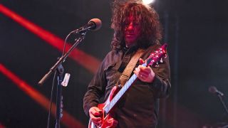 STERLING HEIGHTS, MICHIGAN - JULY 16: Larry "Ler" LaLonde of Primus performs at Michigan Lottery Amphitheatre on July 16, 2025 in Sterling Heights, Michigan. (Photo by Scott Legato/Getty Images)