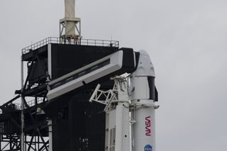 A Falcon 9 rocket and Crew Dragon spacecraft are prepared for the launch of the Crew-2 mission, on launchpad 39A at NASA's Kennedy Space Center in Florida, on April 19, 2021.