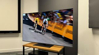LG G4 (OLED65G46LS) OLED TV slight angle showing cyclists on screen