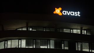 Avast building at night with the lighted sign turned on