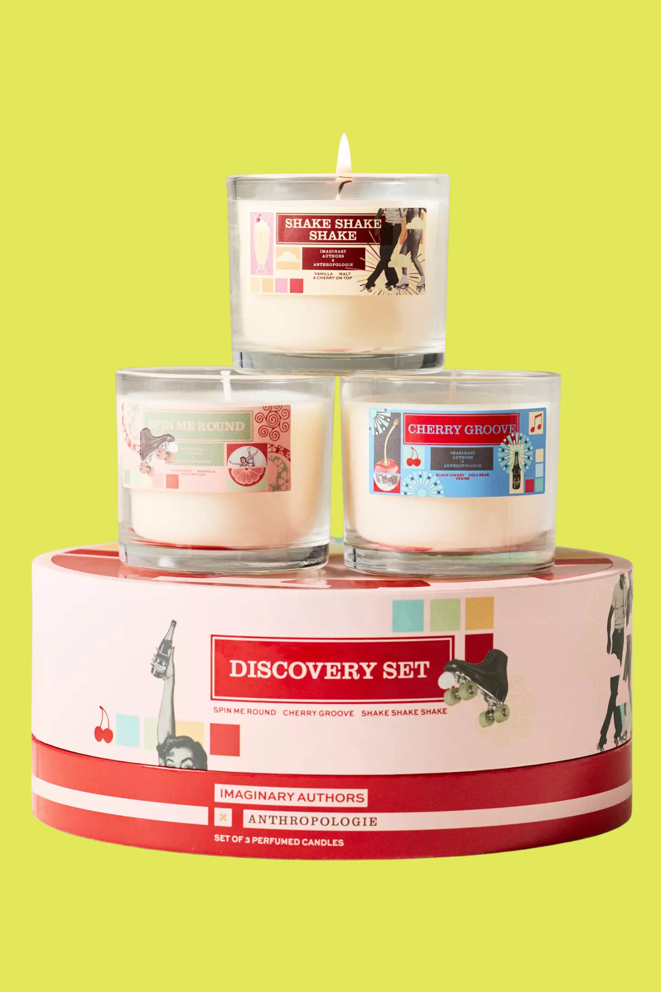 A box with three retro-style glass candles stacked on top