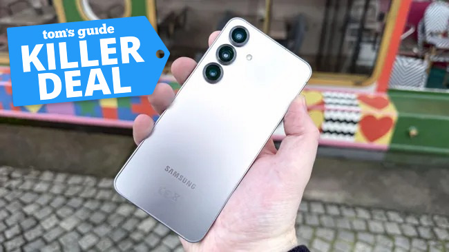 Galaxy S25 held in the hand.