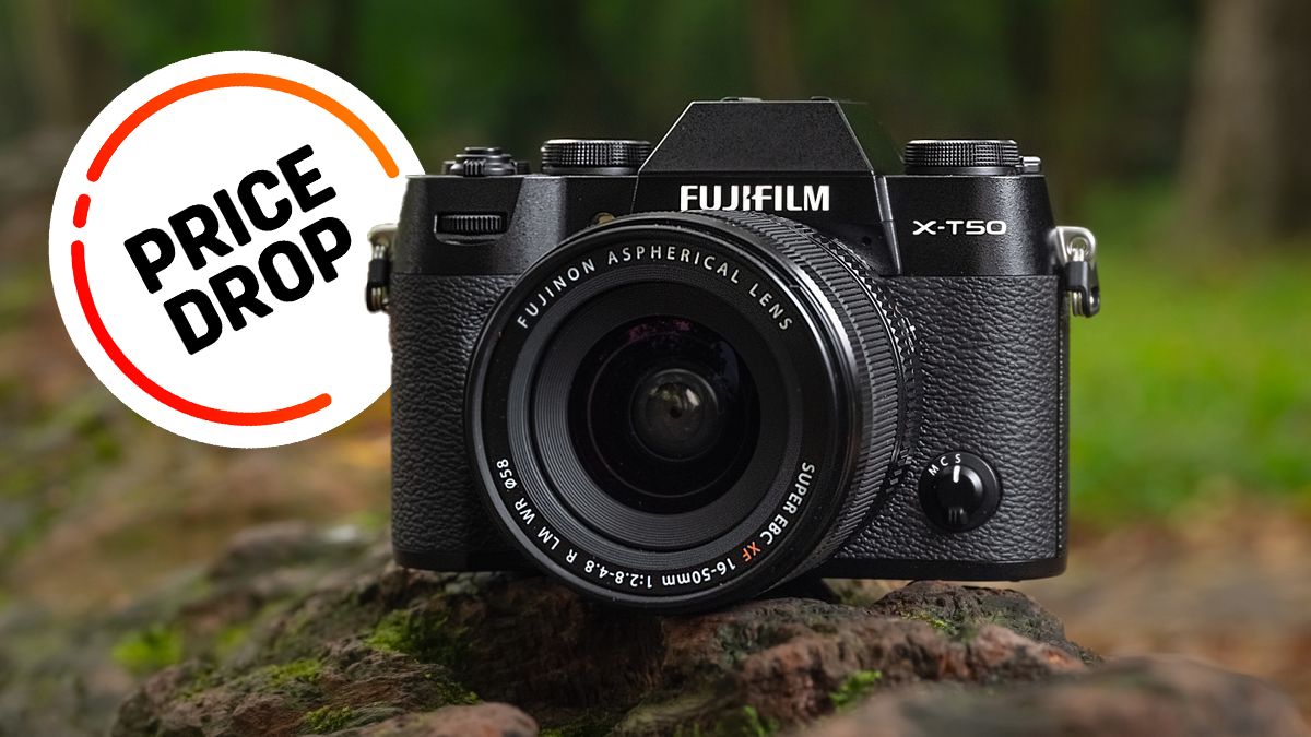 Fujifilm X-T50 camera in outdoor setting with &#039;price drop&#039; graphic