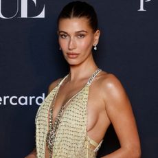 Hailey Bieber attended a Vogue Australia event in a vintage butter yellow Versace gown