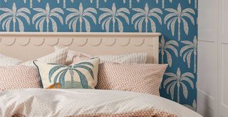bedroom with modern pineapple print wallpaper and cushion with orange geometric bedding