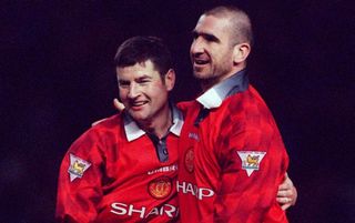 MANCHESTER, ENGLAND - December 21: Denis Irwin of Manchester United and Eric Cantona celebrate during the Premier League match between Manchester United and Sunderland at Old Trafford on December 21, 1996 in Manchester, England. (Photo by Stewart Kendall/Sportsphoto/Allstar via Getty Images)